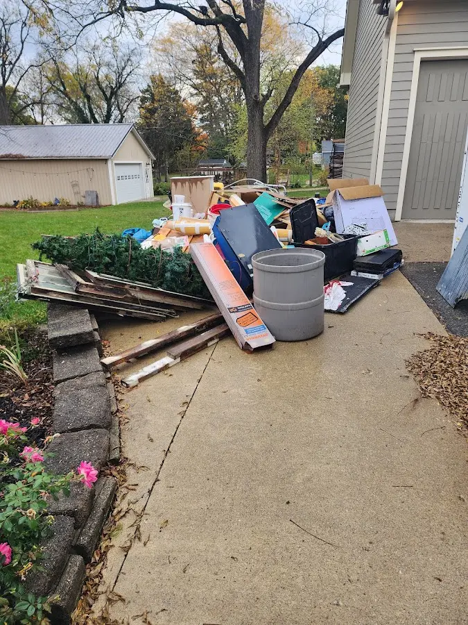 Dumpster being loaded with debris for 30 Yard Dumpster Rental in Fontana